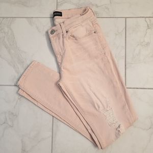 EXPRESS distressed pale pink jean leggings